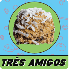Load image into Gallery viewer, Sassy Balls Tres Amigos protein balls made with cherries, blueberries, and raisins, topped with coconut flakes, shown in branded packaging.”