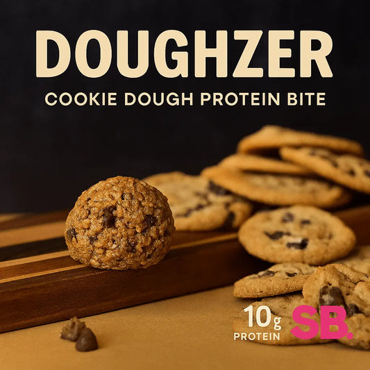 Doughhzer Energy Bites looking stupidly satisfying on wooden board – sweet chewy chocolate chip cookie dough with 10g protein to fuel your hustle