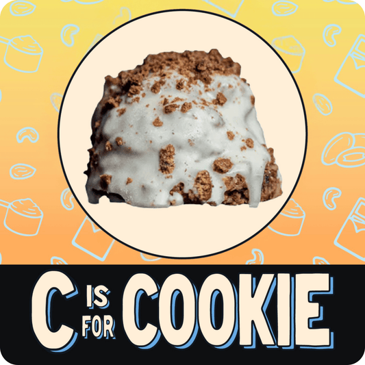 Cookies and cream protein ball with white icing and chocolate cookie pieces.
