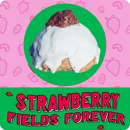 Strawberry shortcake–inspired protein ball with pink‑tinted icing.
